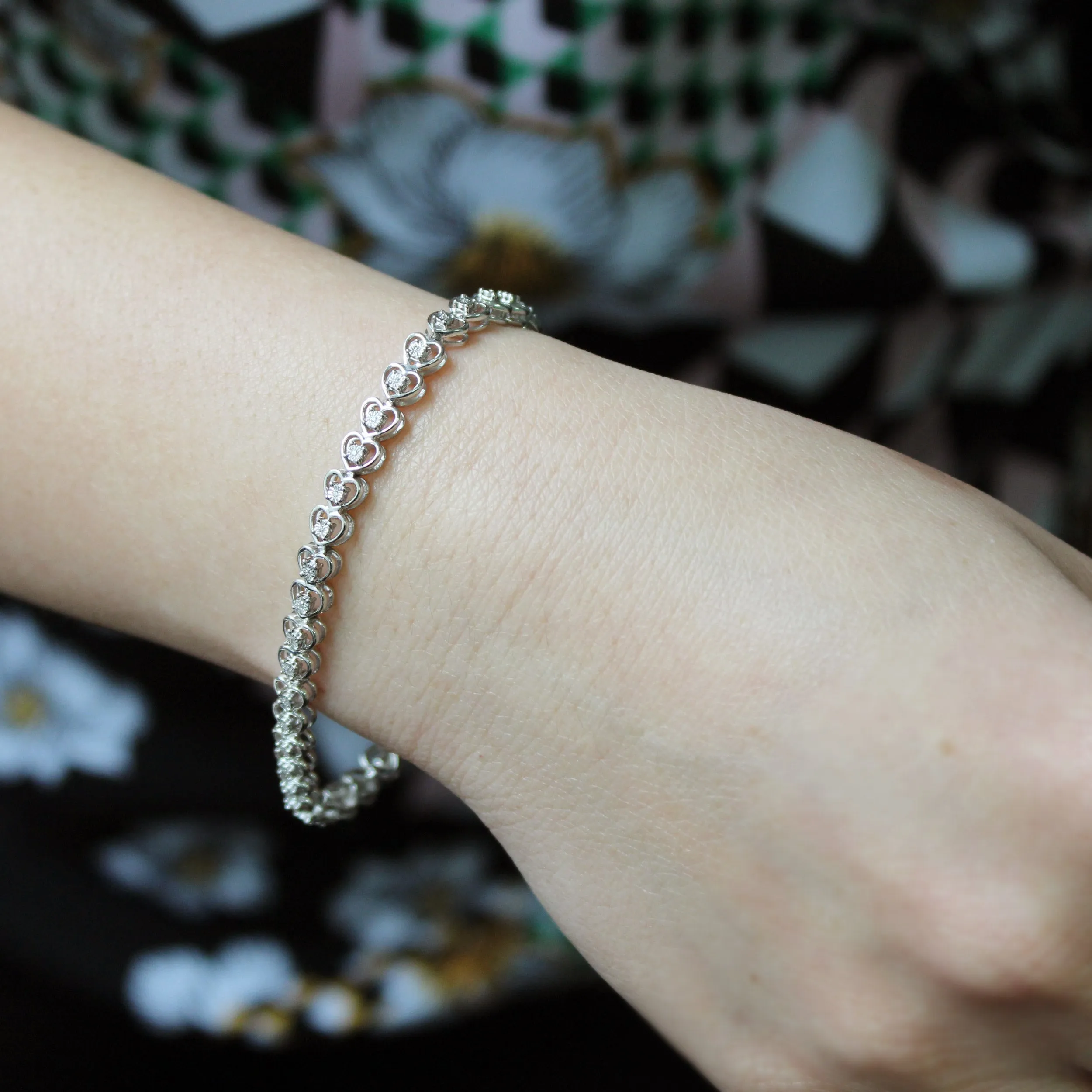 1/8ct tw Diamond Infinity Heart Tennis Bracelet in Sterling Silver