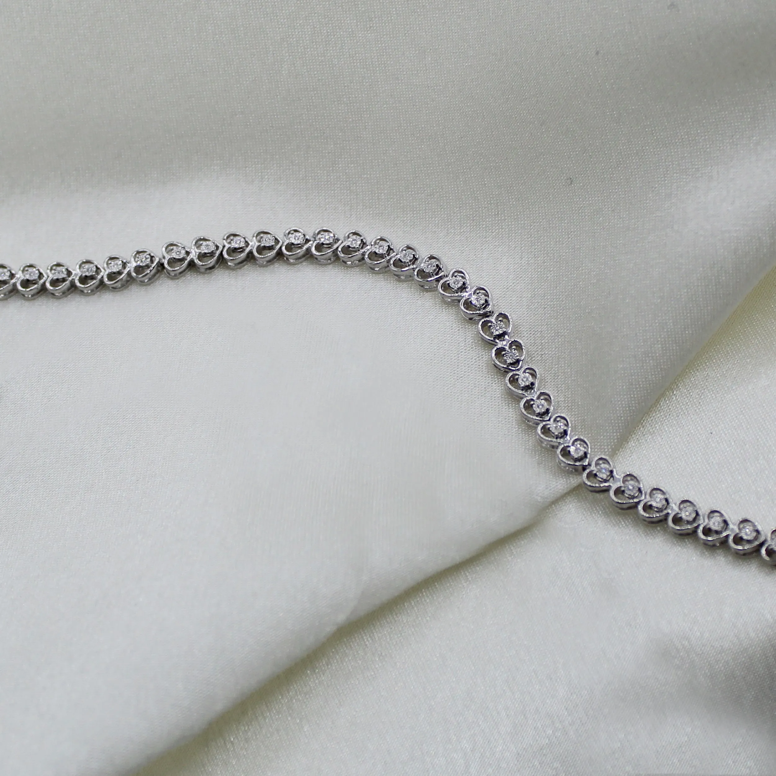 1/8ct tw Diamond Infinity Heart Tennis Bracelet in Sterling Silver