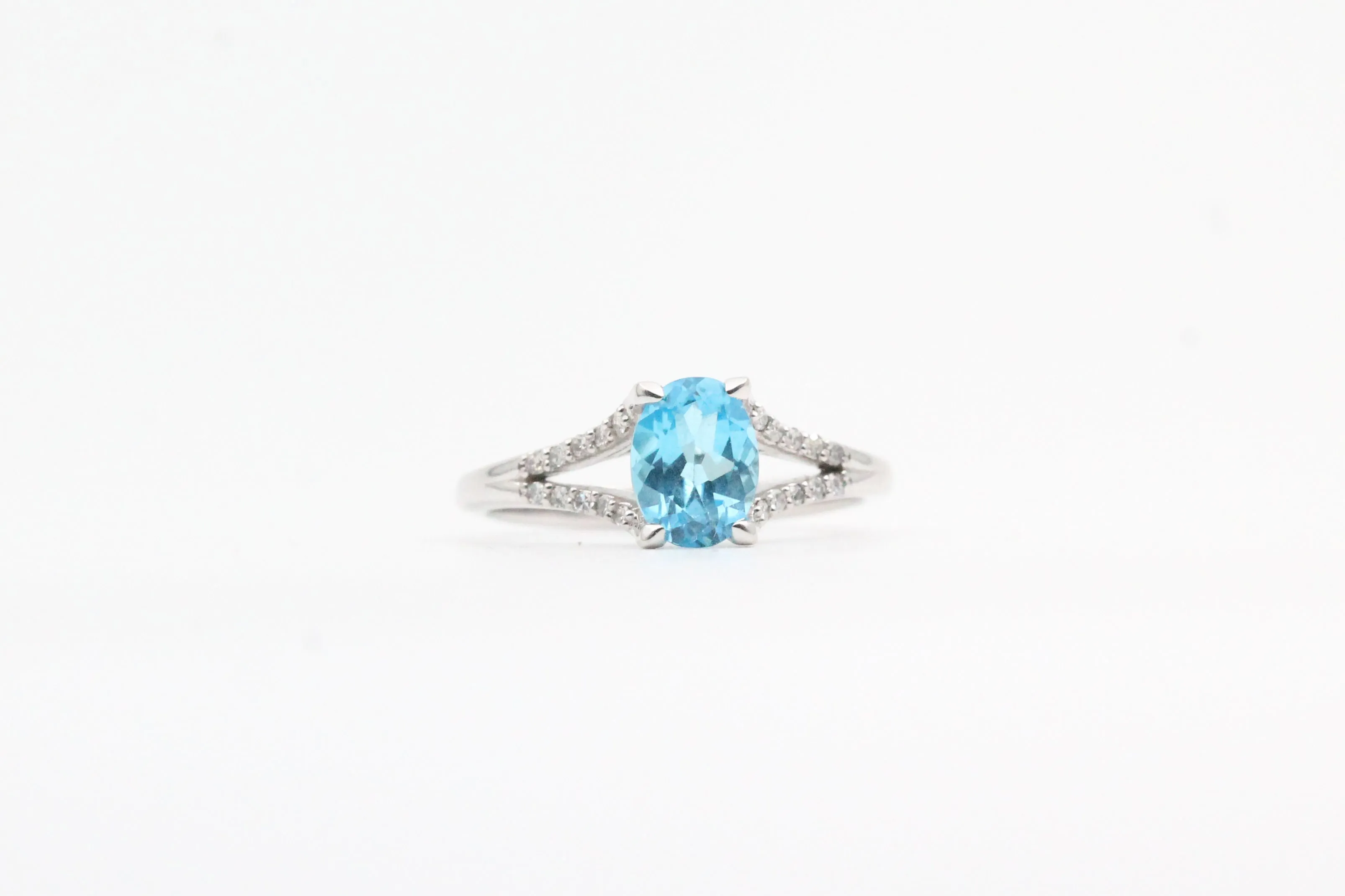 White Gold Blue Topaz Split Shank Ring