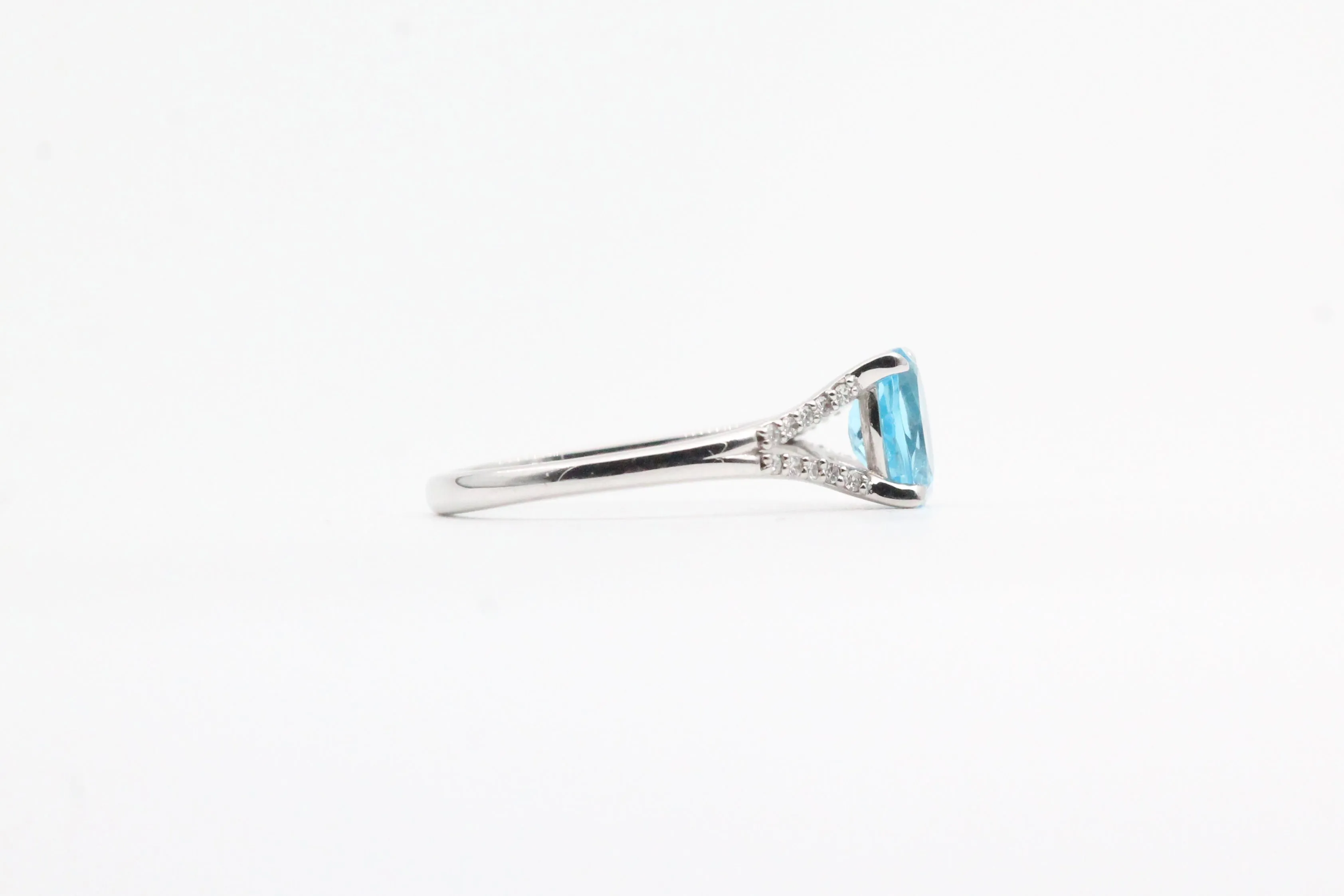 White Gold Blue Topaz Split Shank Ring